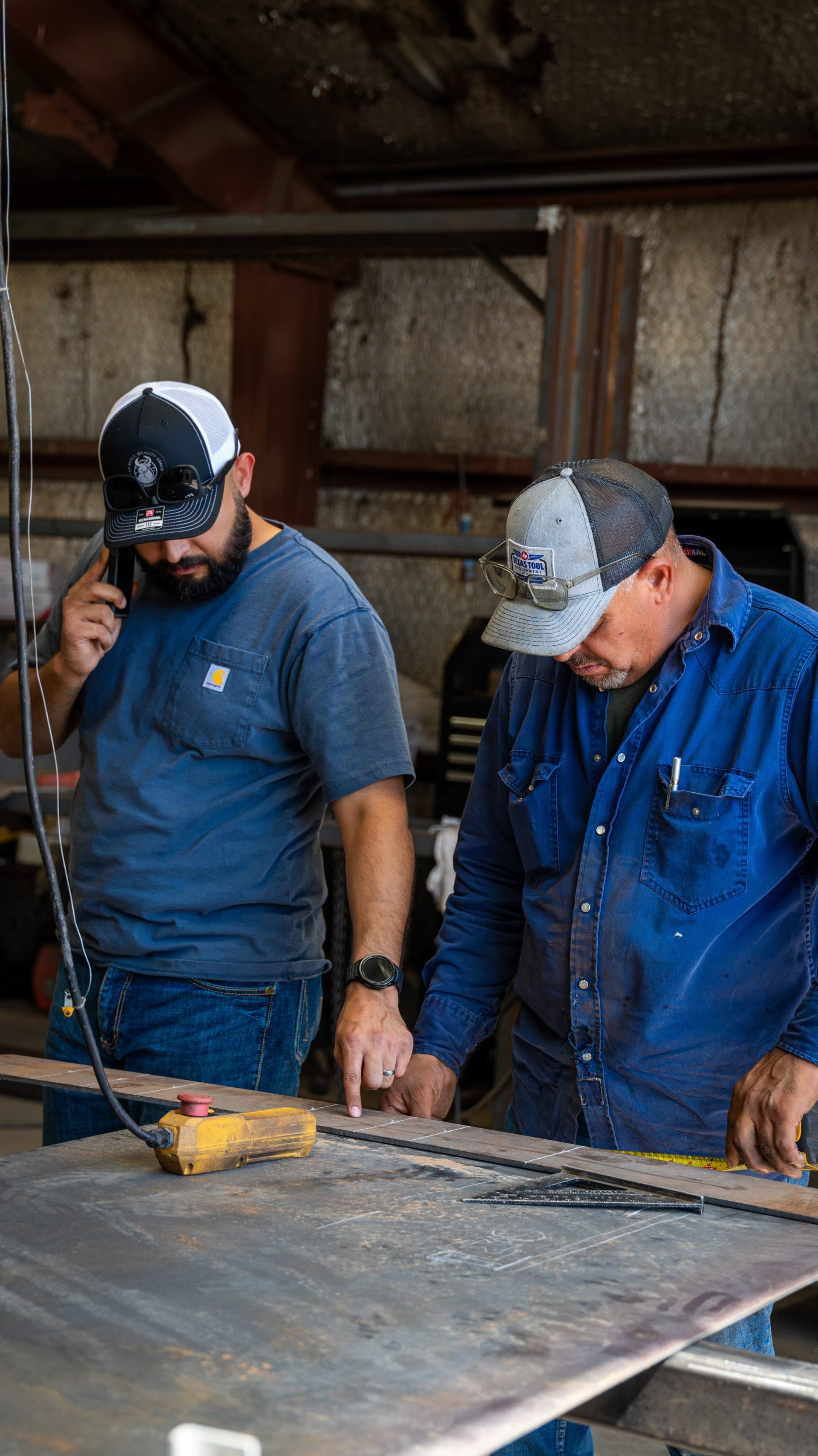V&S Trades crew reviewing work together in the shop